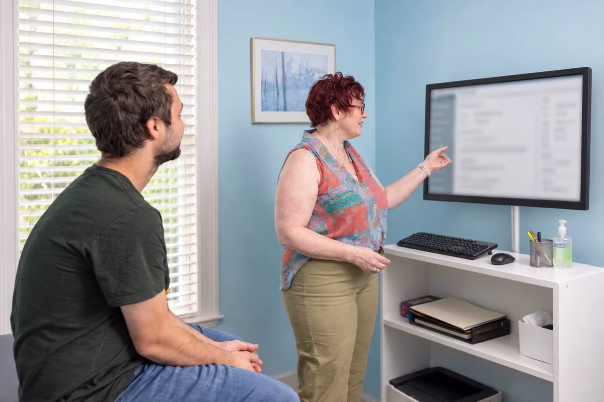 Dr. Billiot explaining findings to a patient